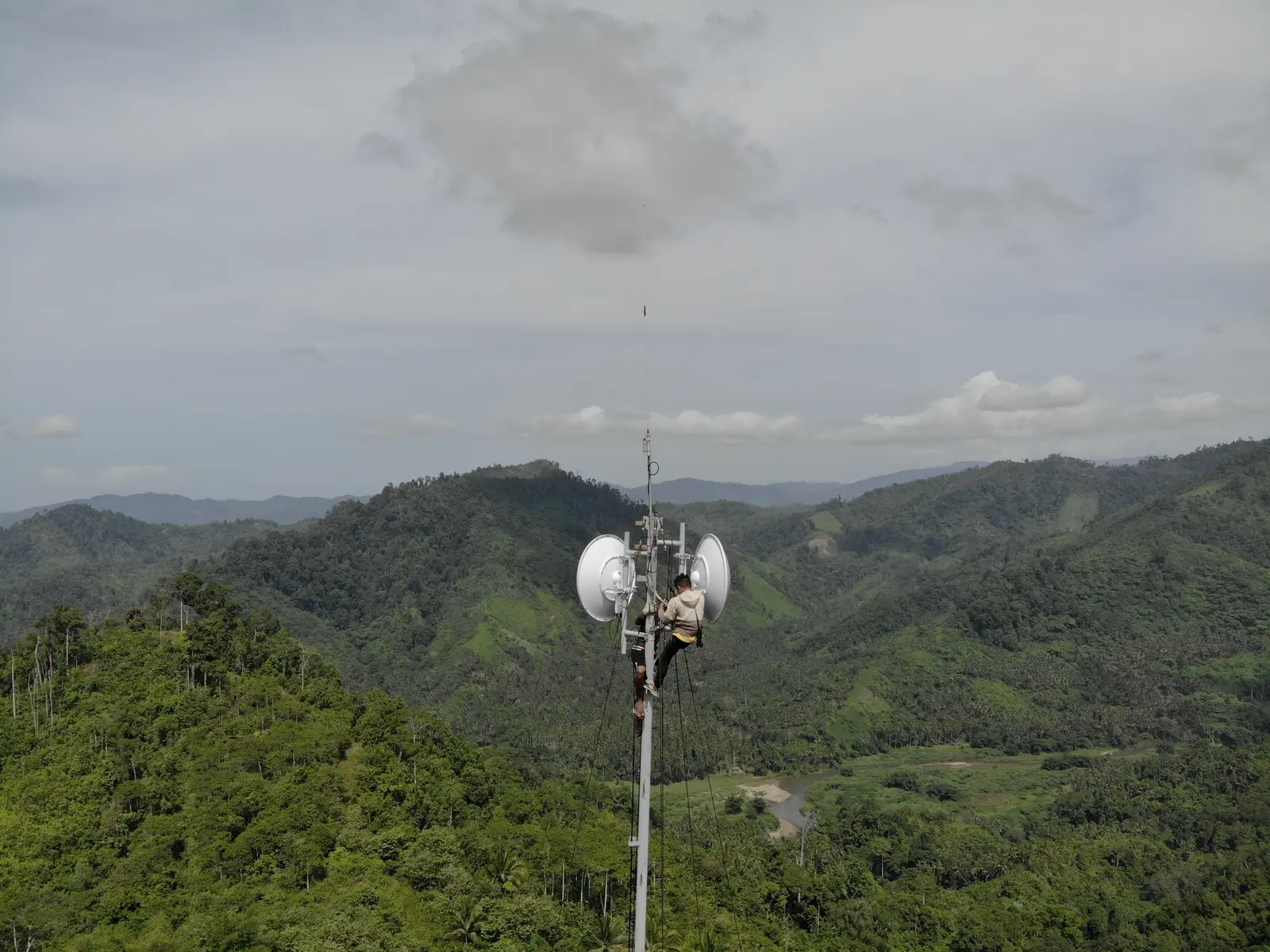 Elevated ATECH point-to-point antennas above mountainous terrain.